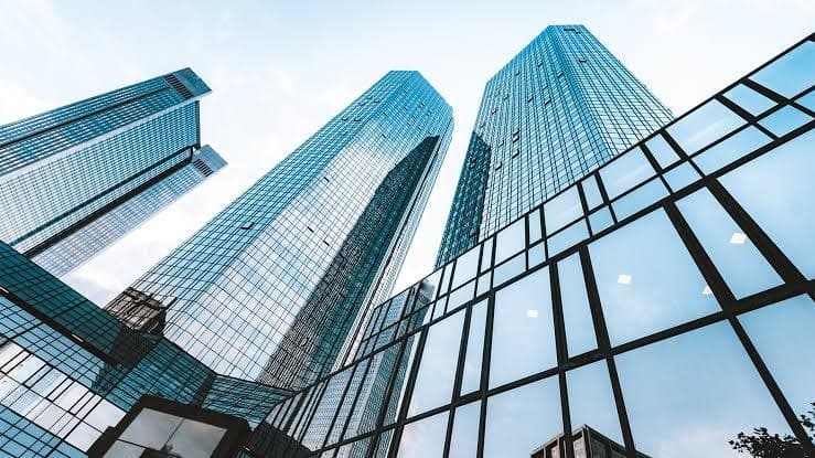 Glass office towers seen from street level